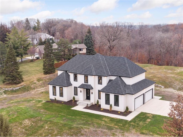 view of front of house with a garage and a front yard