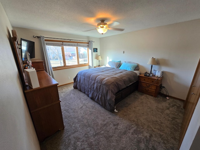 carpeted bedroom featuring a textured ceiling and ceiling fan