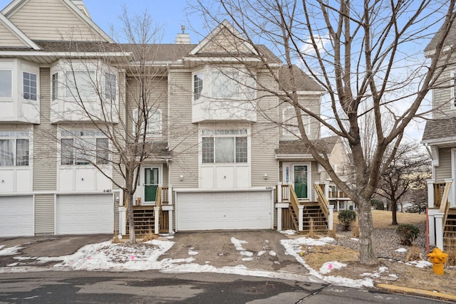 multi unit property featuring a garage