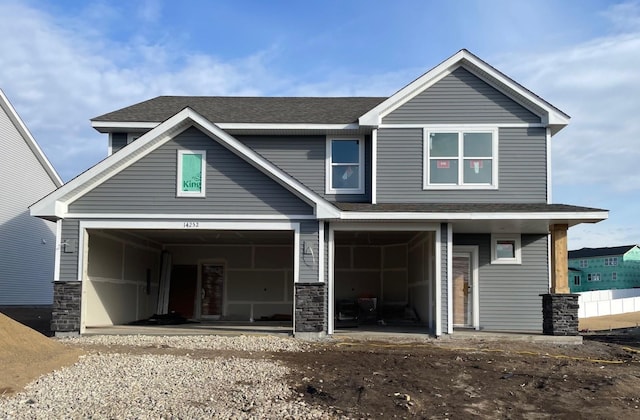 craftsman inspired home featuring a garage