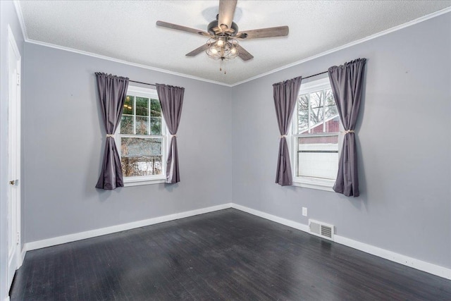 spare room with ceiling fan, ornamental molding, dark hardwood / wood-style floors, and a textured ceiling