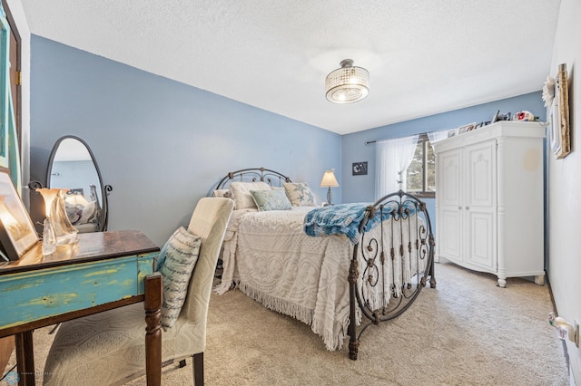 carpeted bedroom with a textured ceiling