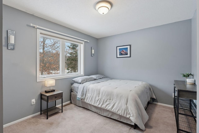 bedroom with light carpet