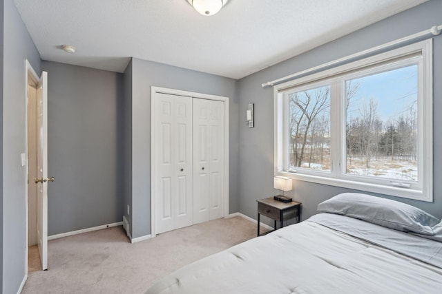 carpeted bedroom featuring a closet