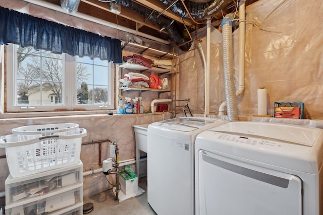 clothes washing area featuring independent washer and dryer