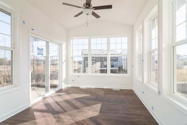 unfurnished sunroom featuring ceiling fan, lofted ceiling, and a healthy amount of sunlight