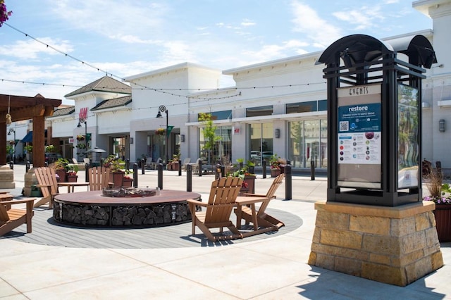 view of patio / terrace featuring an outdoor fire pit