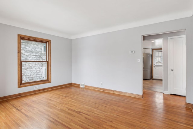 empty room with light wood-type flooring