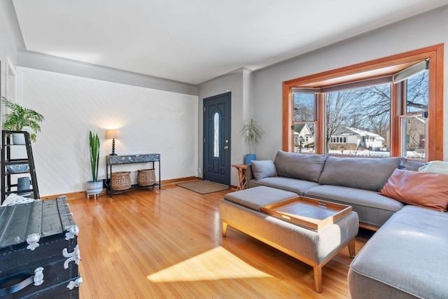 living room featuring wood finished floors and baseboards