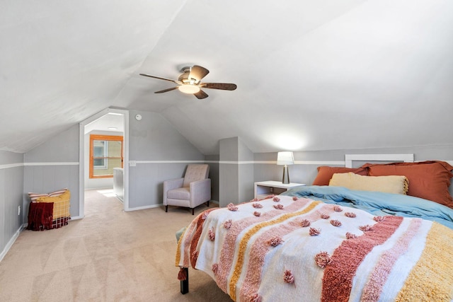 carpeted bedroom featuring lofted ceiling, a ceiling fan, and baseboards