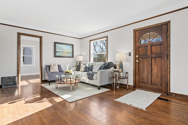 living room with wood-type flooring and ornamental molding