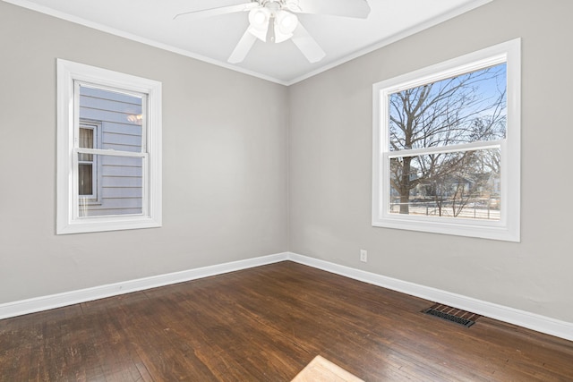 unfurnished room with crown molding, ceiling fan, and dark hardwood / wood-style flooring