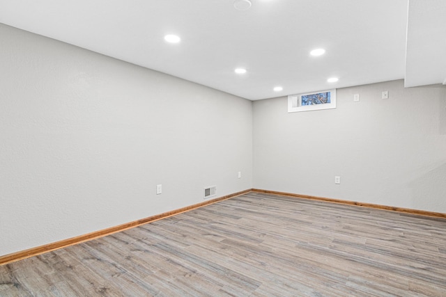 unfurnished room with light hardwood / wood-style flooring