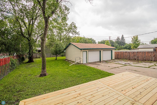 deck with a detached garage and an outdoor structure