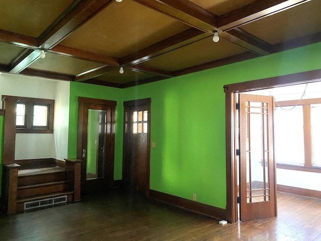 spare room with hardwood / wood-style flooring, coffered ceiling, and beam ceiling