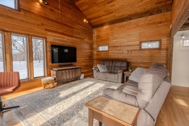 living room with high vaulted ceiling, wooden ceiling, and wood walls