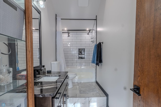 full bathroom with vanity, toilet, and tiled shower / bath