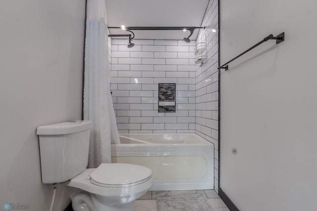 bathroom with toilet and shower / bath combo with shower curtain