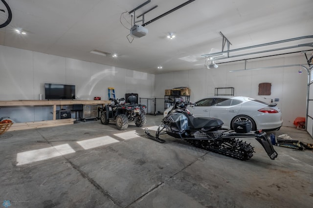 garage featuring a garage door opener