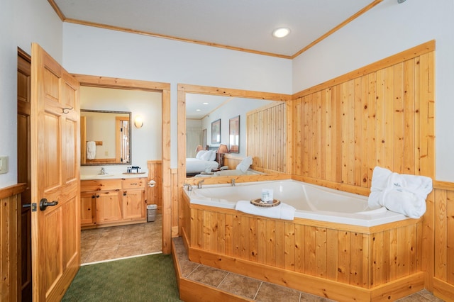 bathroom featuring vanity, wooden walls, ornamental molding, and a bathing tub