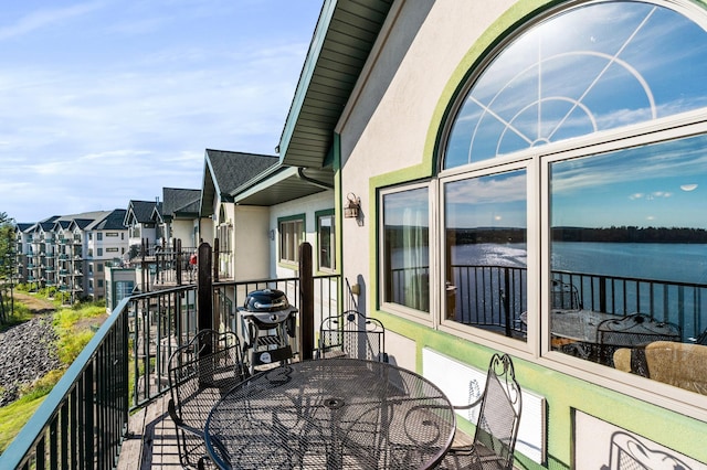 balcony featuring a water view