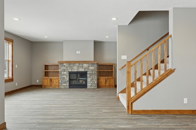 living room featuring a fireplace and light hardwood / wood-style flooring