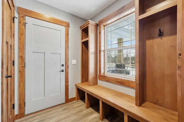 mudroom with light hardwood / wood-style floors