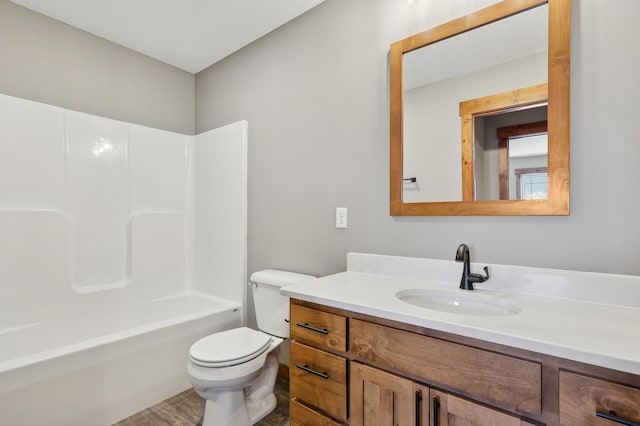 full bathroom featuring shower / bathtub combination, vanity, and toilet