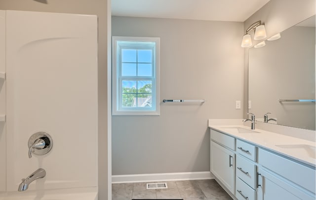 bathroom with vanity and tile patterned floors