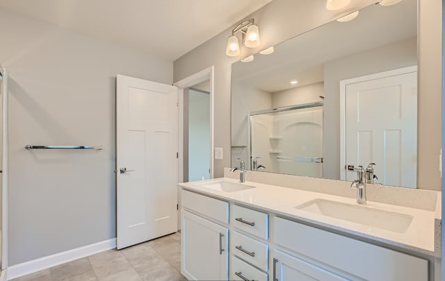 bathroom with vanity and an enclosed shower