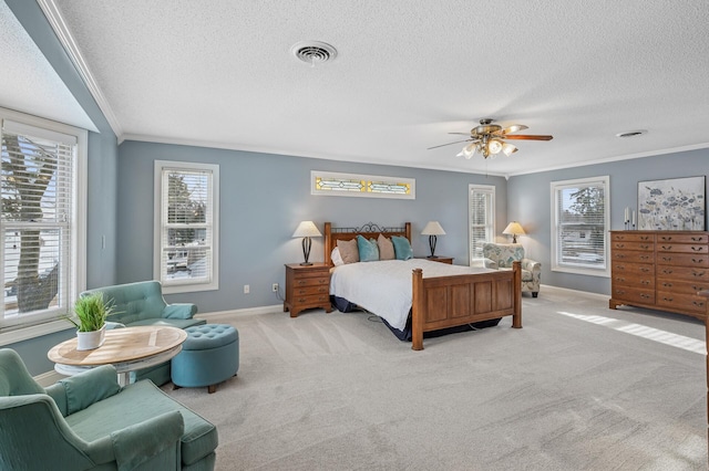 carpeted bedroom featuring a textured ceiling, baseboards, visible vents, and ornamental molding