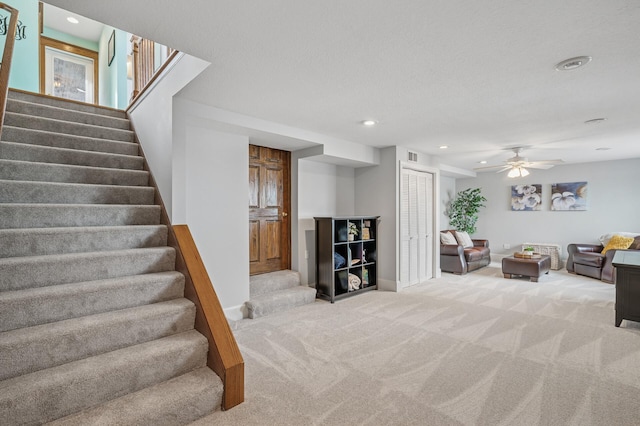 staircase featuring visible vents, recessed lighting, ceiling fan, and carpet floors