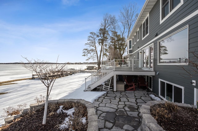 exterior space with stairway and a wooden deck