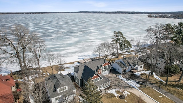 birds eye view of property with a water view and a residential view