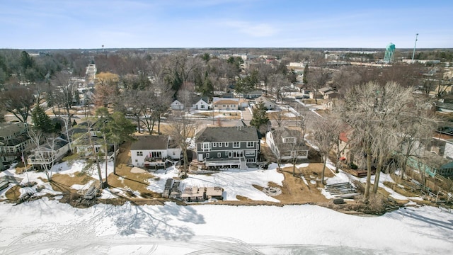 snowy aerial view with a residential view