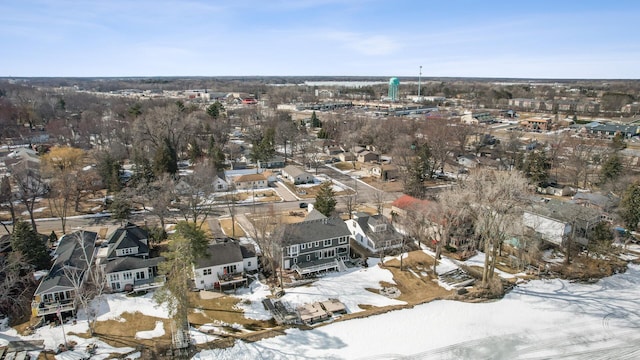 snowy aerial view with a residential view