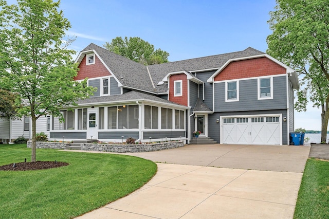 255 Shore Dr, Forest Lake, MN 55025 - view of front of home with a sunroom, driveway, an attached garage, a front yard, and roof with shingles