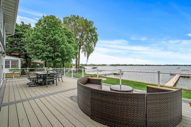 255 Shore Dr, Forest Lake, MN 55025 - deck with outdoor dining area and a water view