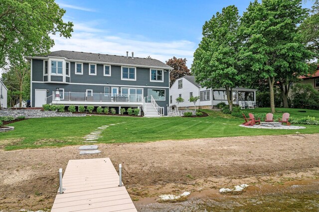 255 Shore Dr, Forest Lake, MN 55025 - rear view of property featuring an outdoor fire pit, a yard, and stairs