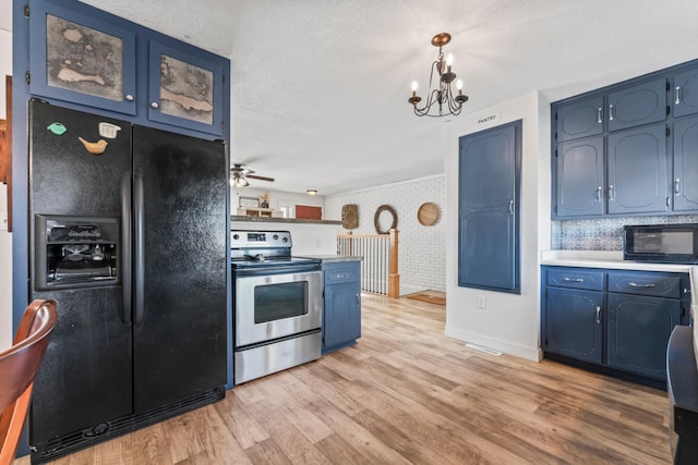 kitchen with brick wall, pendant lighting, light hardwood / wood-style floors, black appliances, and blue cabinetry