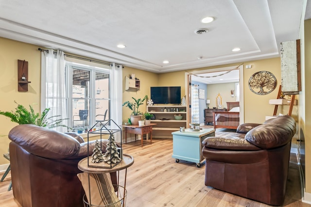 living room with light hardwood / wood-style flooring