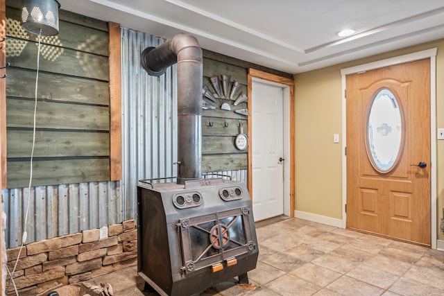 entrance foyer featuring a wood stove