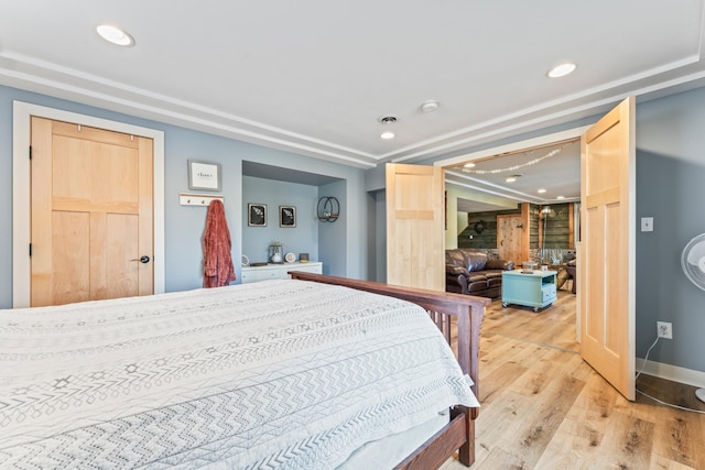 bedroom with light wood-type flooring