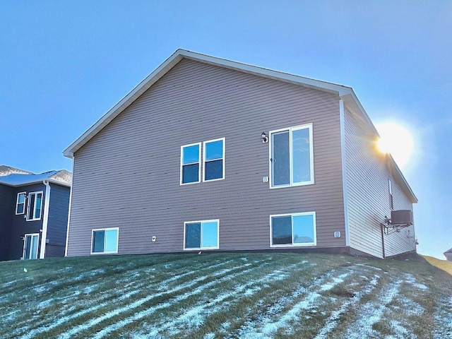 view of snow covered rear of property