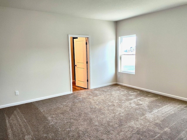 unfurnished room with carpet flooring