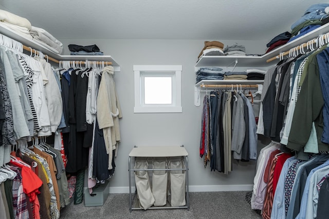 spacious closet featuring dark carpet