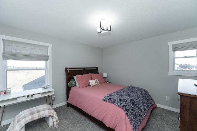 bedroom with dark carpet