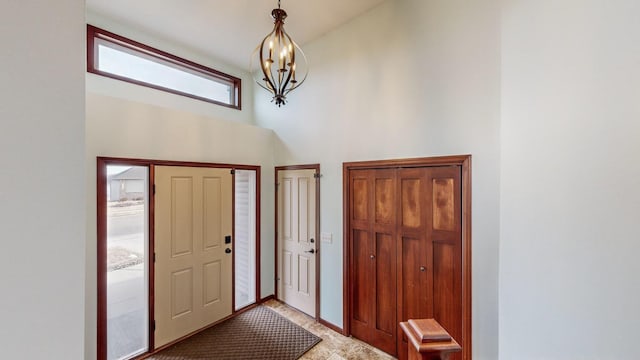 foyer entrance with an inviting chandelier