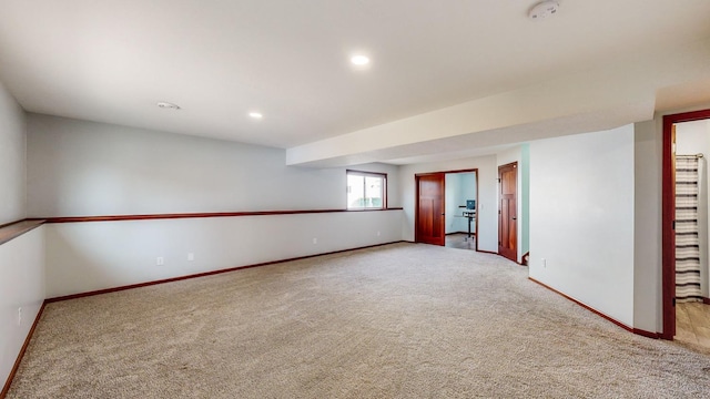 empty room featuring light colored carpet