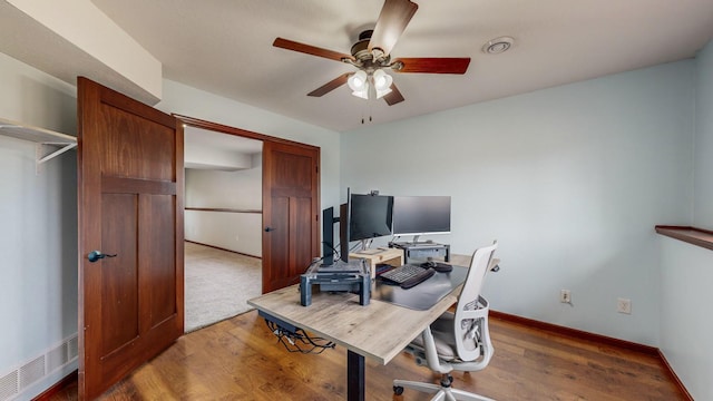 office featuring hardwood / wood-style floors and ceiling fan